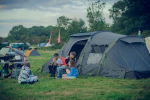 Riverside camping pitch, tent camping at Wild Canvas Camping, UK
